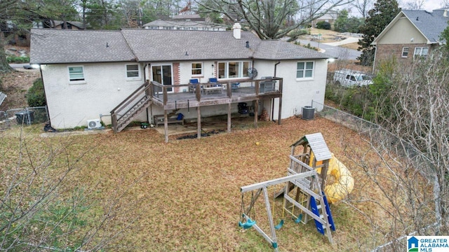 rear view of property with central air condition unit and a wooden deck