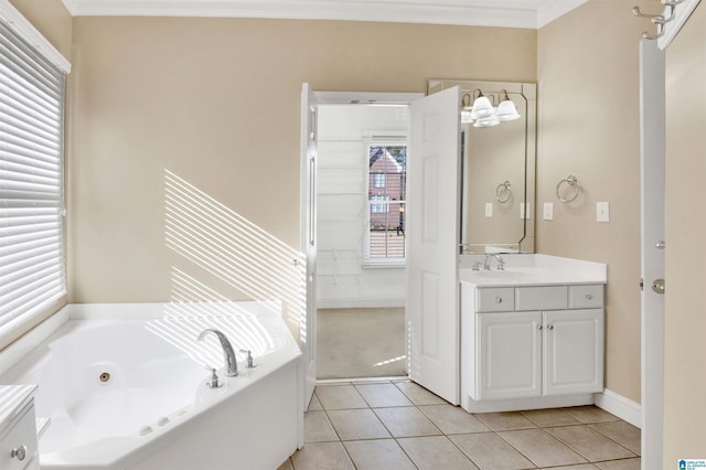 bathroom featuring tile patterned flooring, vanity, ornamental molding, and a tub to relax in