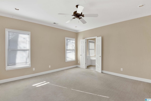 unfurnished bedroom featuring multiple windows, ceiling fan, and light carpet