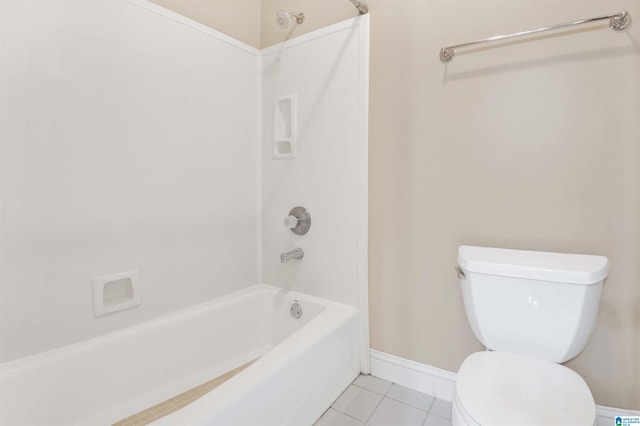 bathroom featuring tile patterned floors, shower / bathtub combination, and toilet