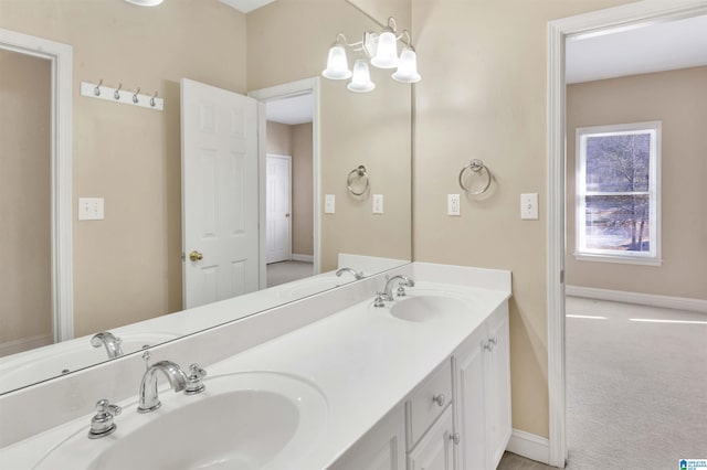 bathroom featuring vanity and a chandelier