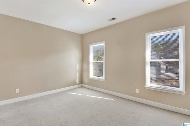 empty room with light colored carpet