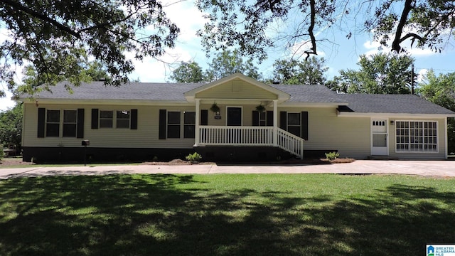 ranch-style house with a porch and a front lawn