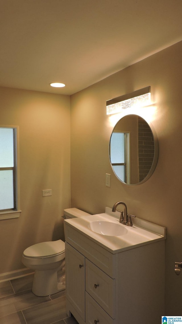 bathroom with vanity and toilet