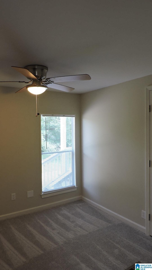 carpeted empty room with ceiling fan