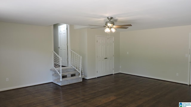 empty room featuring ceiling fan and dark hardwood / wood-style flooring