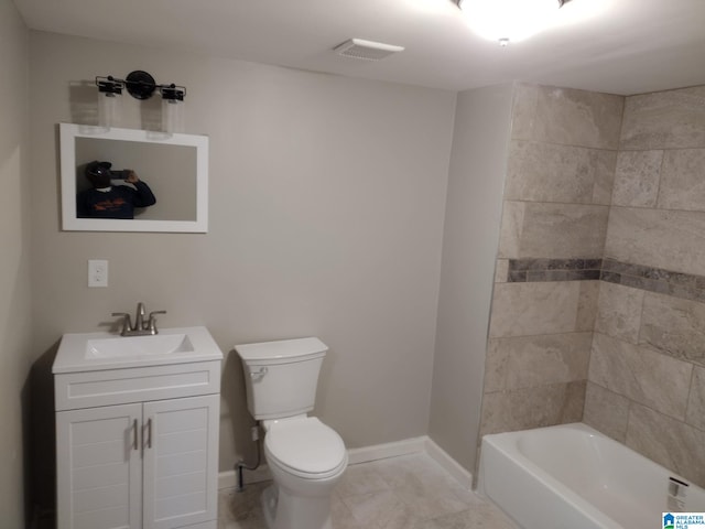 full bathroom with vanity, toilet, and tiled shower / bath