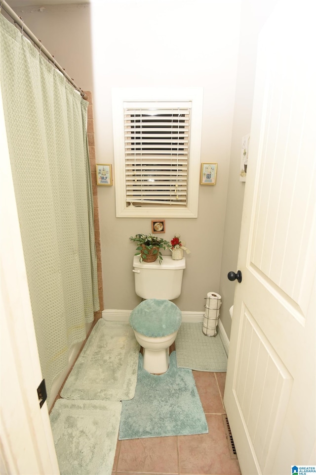 bathroom featuring tile patterned floors and toilet