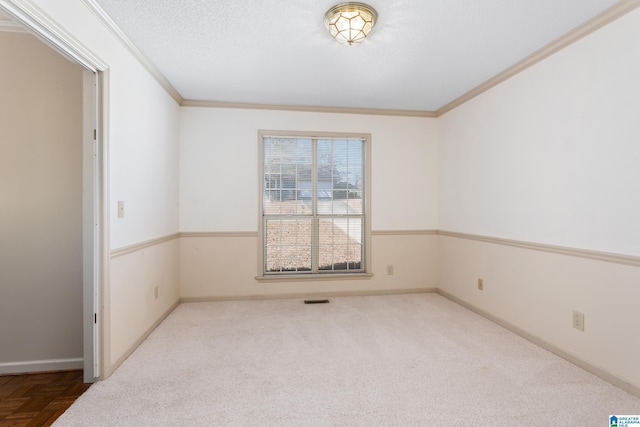 spare room with crown molding