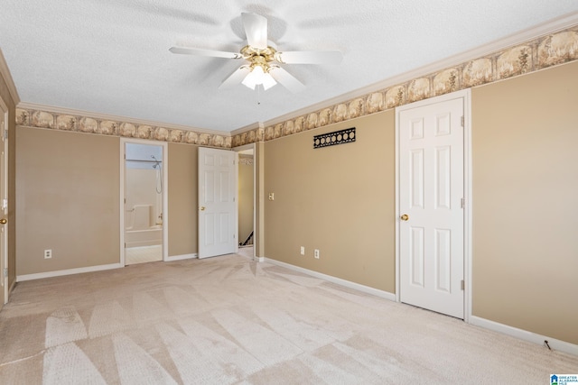 unfurnished bedroom with light carpet, a textured ceiling, ceiling fan, and crown molding