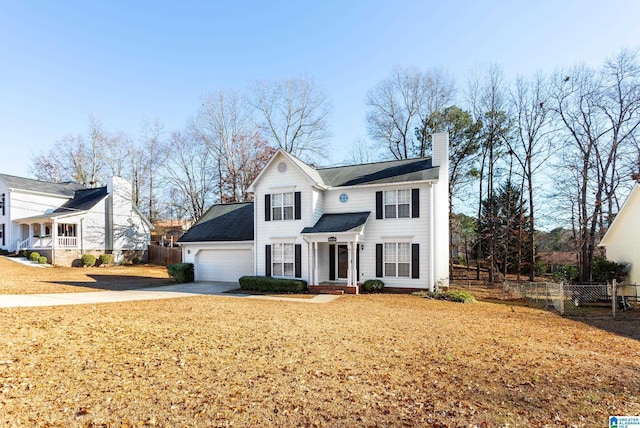 view of front of property with a front lawn and a garage