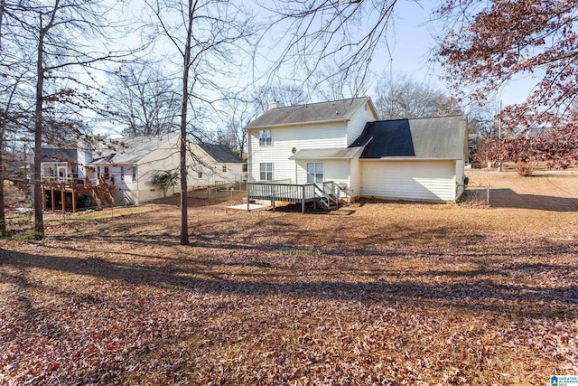 rear view of house with a wooden deck