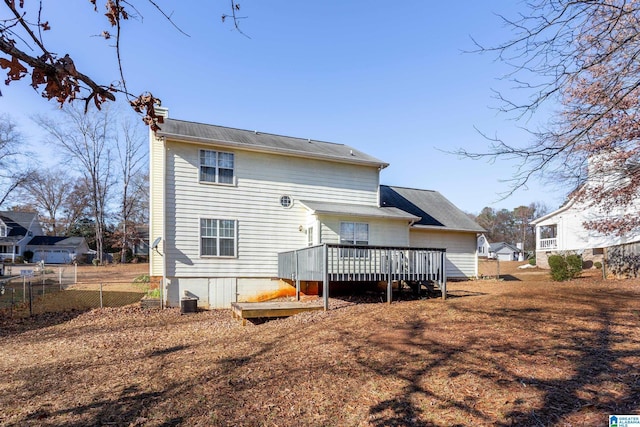 back of house featuring a deck and central air condition unit