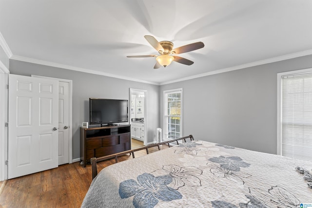 bedroom with connected bathroom, ceiling fan, crown molding, and dark hardwood / wood-style floors