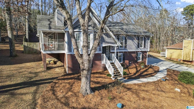 view of front of house with a sunroom