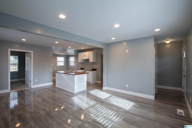 kitchen with white cabinets and a center island