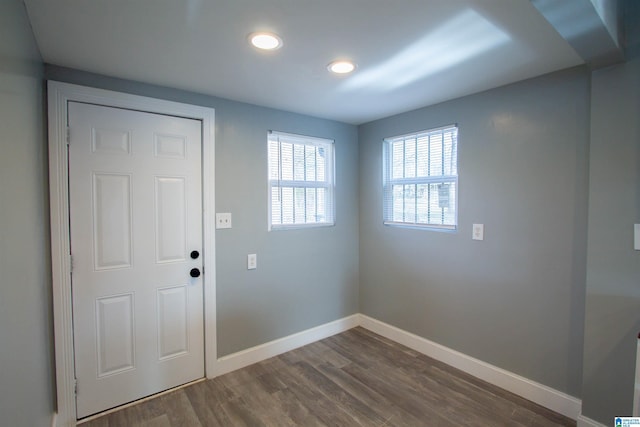 entryway with dark wood-type flooring