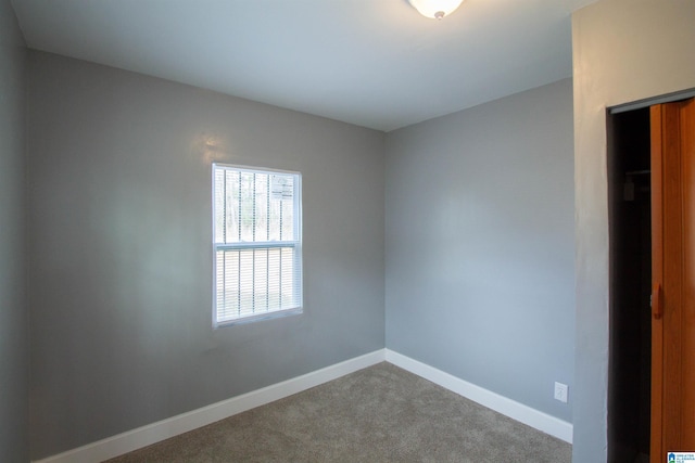 unfurnished room with carpet floors