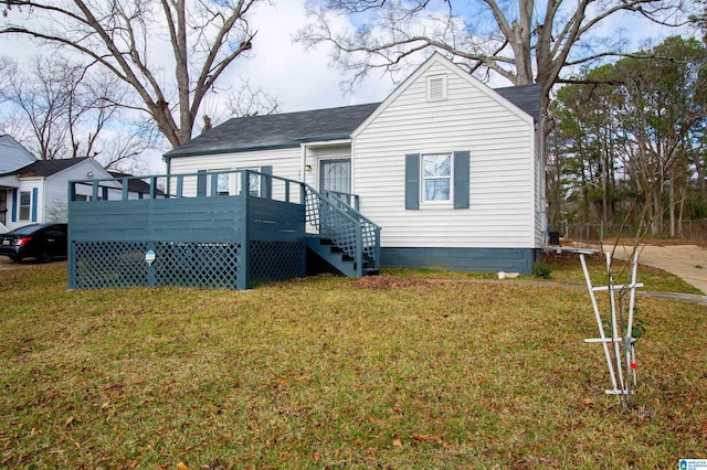 exterior space with a deck and a front lawn