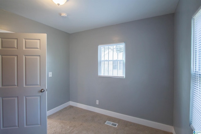 empty room with light colored carpet