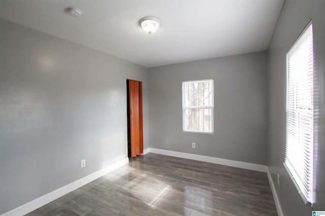 spare room featuring dark hardwood / wood-style floors