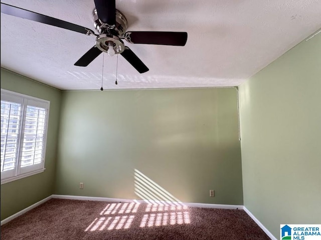 empty room featuring carpet flooring and ceiling fan