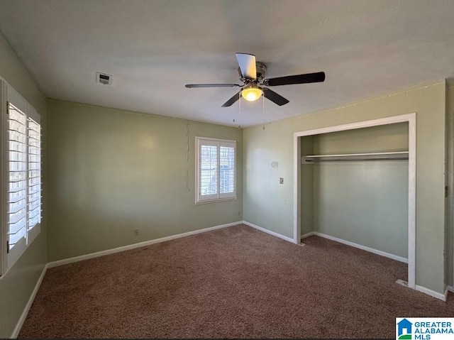 unfurnished bedroom featuring carpet flooring, ceiling fan, and a closet