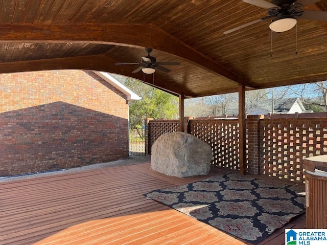 wooden terrace featuring ceiling fan