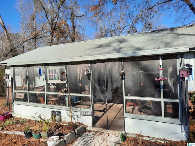 exterior space featuring a sunroom