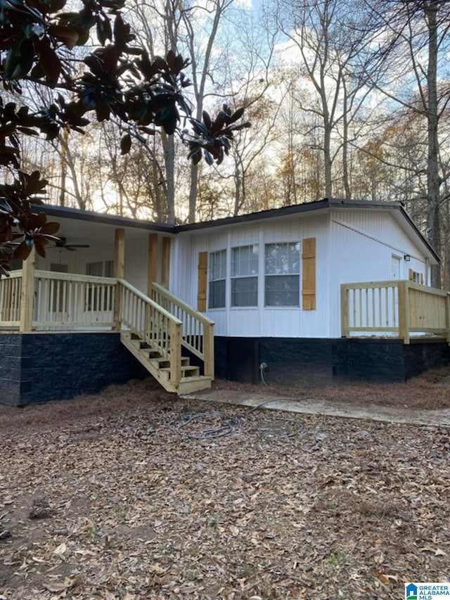 exterior space with ceiling fan and covered porch