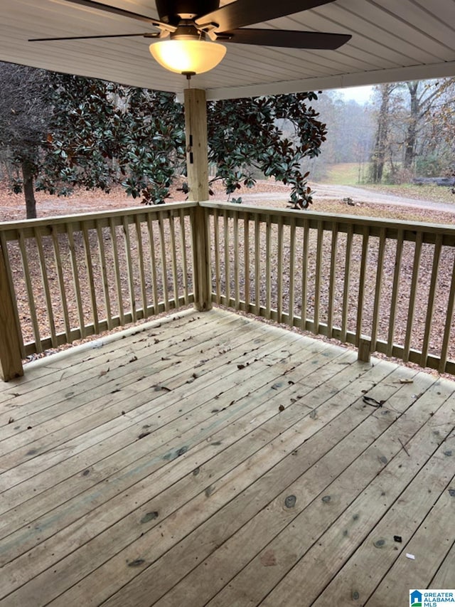 wooden deck featuring ceiling fan