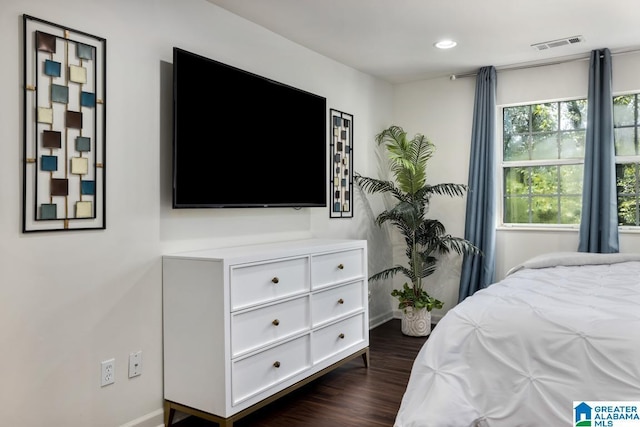 bedroom featuring dark wood-type flooring