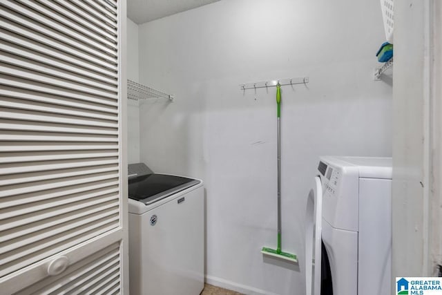 laundry room with washing machine and dryer