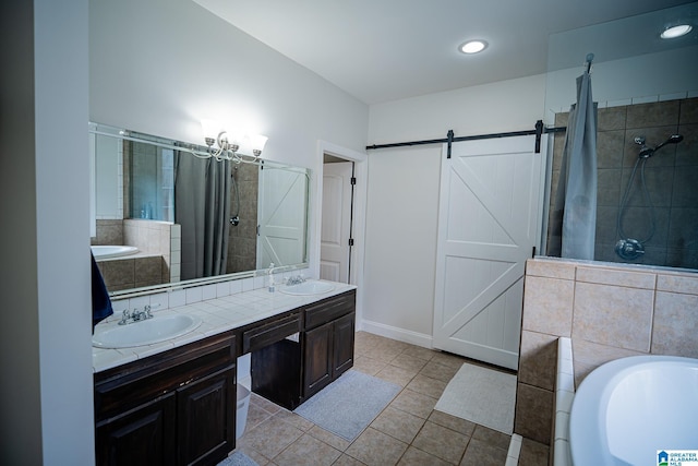 bathroom featuring a sink, a garden tub, tile patterned floors, and a tile shower