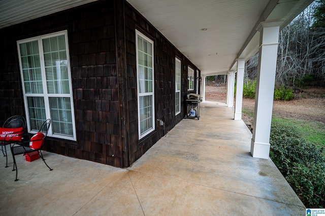 view of patio featuring a porch