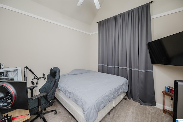 bedroom with ceiling fan, carpet, and vaulted ceiling