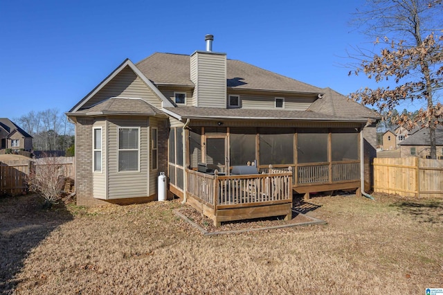 back of house featuring a sunroom