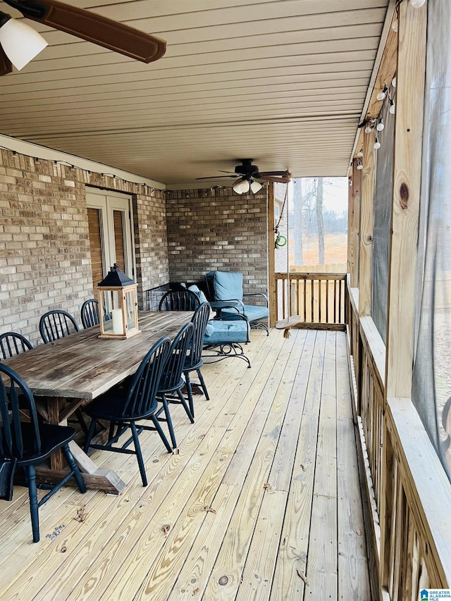 deck with french doors and ceiling fan