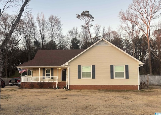 ranch-style home featuring a porch