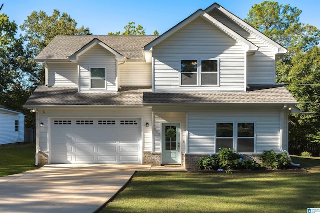 view of front of house with a garage and a front yard