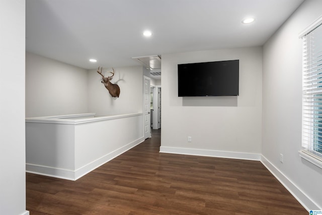 bar with dark hardwood / wood-style floors