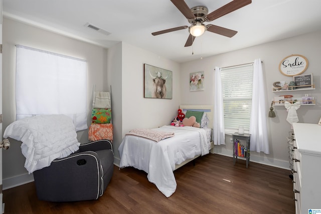 bedroom featuring ceiling fan and dark wood-type flooring