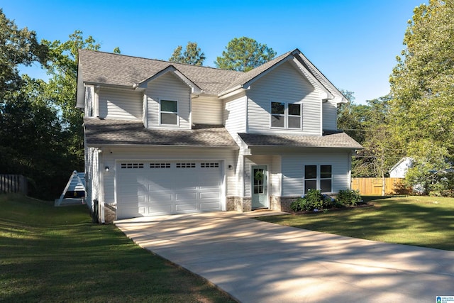 view of front of home with a front yard and a garage