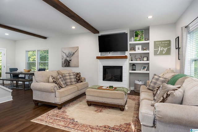 living room with wood-type flooring and beam ceiling