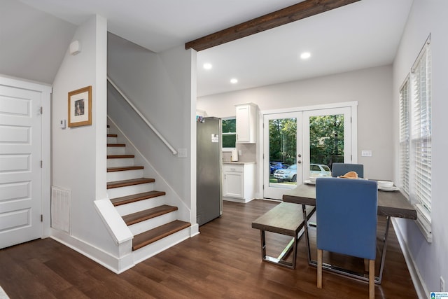 dining room with beamed ceiling, dark wood-type flooring, and french doors