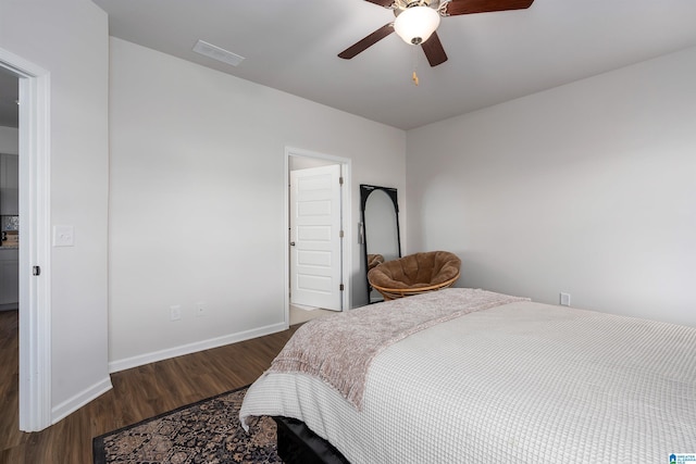 bedroom featuring dark hardwood / wood-style floors and ceiling fan