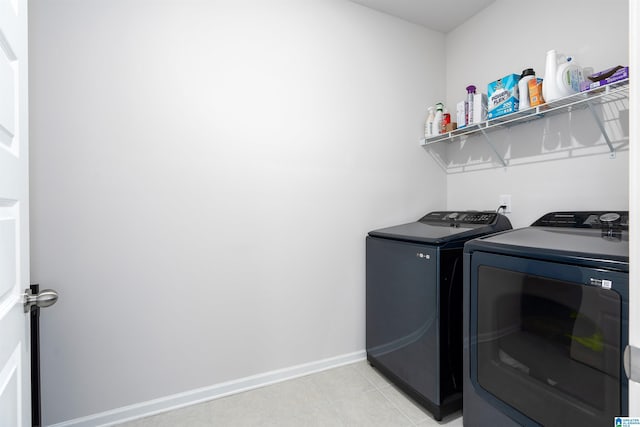 laundry area with washing machine and clothes dryer