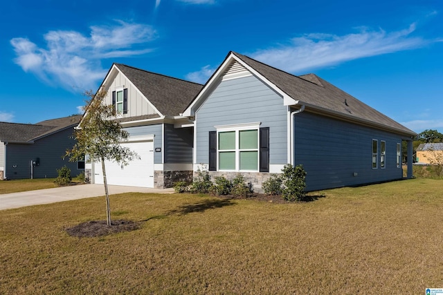 view of front of property featuring a garage and a front lawn