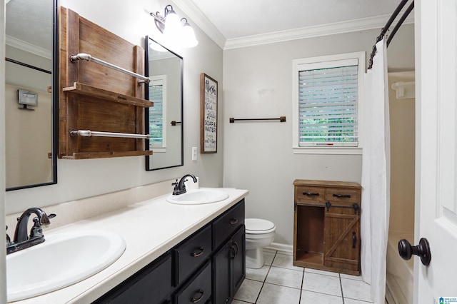 bathroom with toilet, vanity, tile patterned floors, and ornamental molding