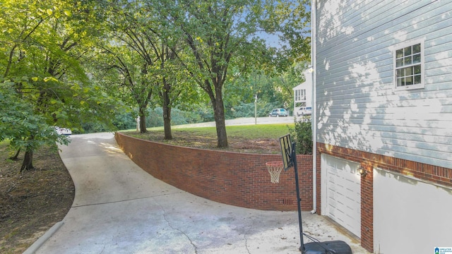 view of patio / terrace featuring a garage